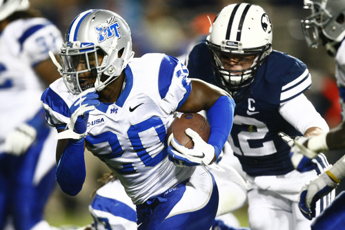 Chris Detrick  |  The Salt Lake Tribune
Middle Tennessee Blue Raiders safety Kevin Byard (20) runs past Brigham Young Cougars wide receiver JD Falslev (12) after intercepting the ball during the second half of the game at LaVell Edwards Stadium Friday September 27, 2013.